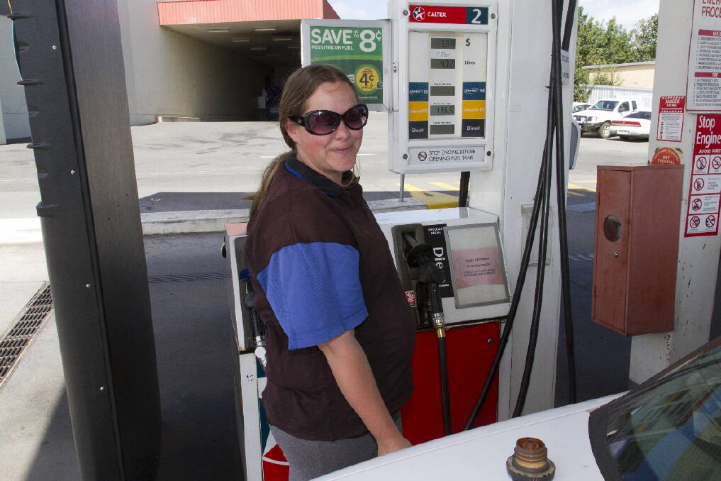 Shae Williams takes advantage of the petrol price drop, filling up her vehicle in Ararat last week.