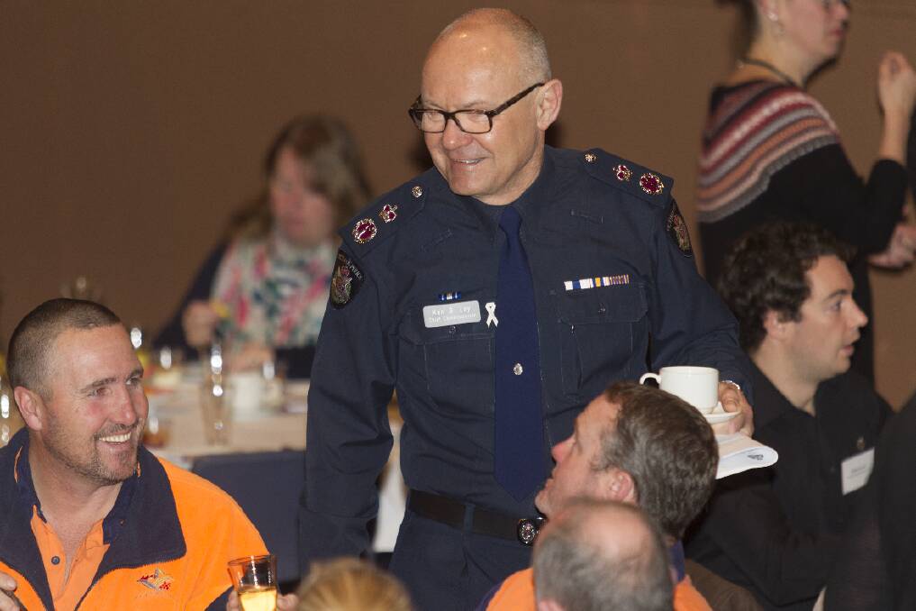 Chief Commissioner Ken Lay speaks to Tyron Hammerstein at the breakfast.