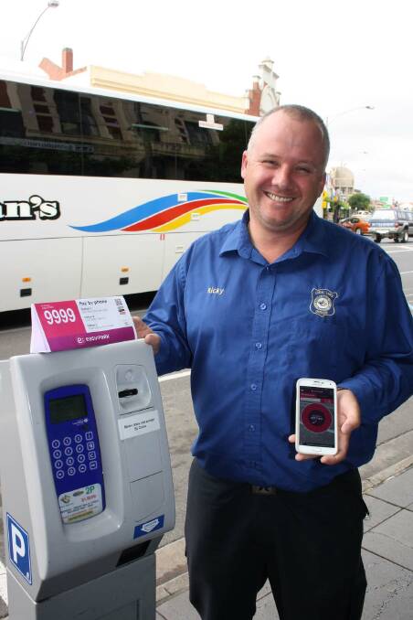 Ararat Rural City Local Laws Officer Ricky Bowen displaying the new Easypay parking meter App.
