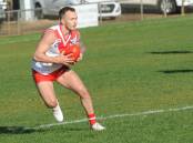 STEADY: Ararat's Jake Robinson looks to move the ball on quickly during the second quarter of the match