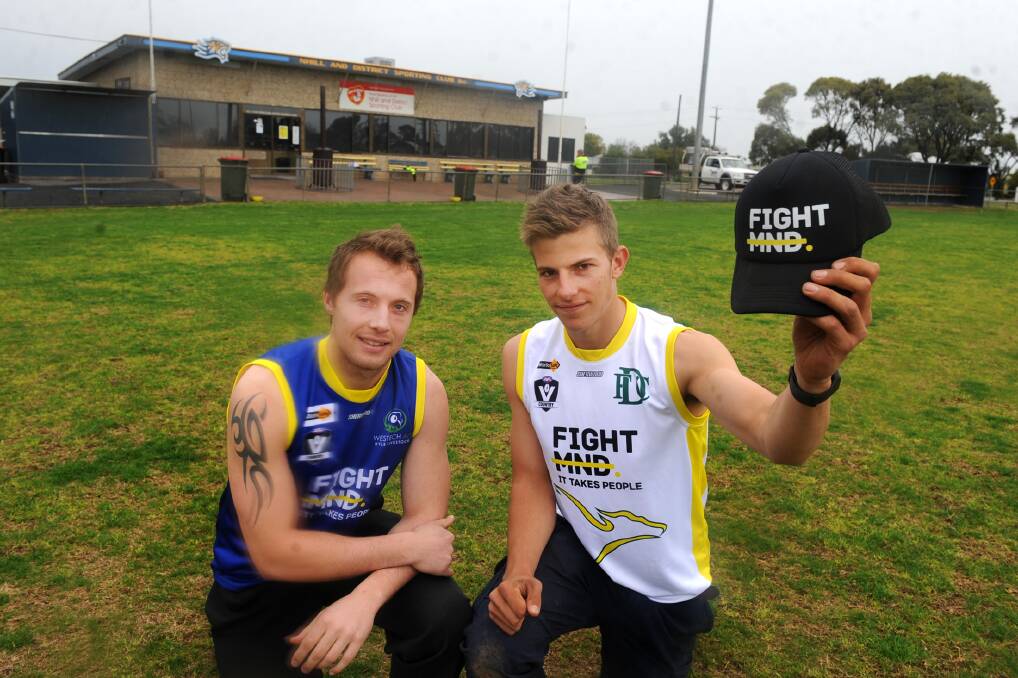 SUPPORT: Nhill's Liam Albrecht and Dimboola's Ben Miller donning the special jumpers that will be auctioned off after Saturday's game. Picture: SAMANTHA CAMARRI