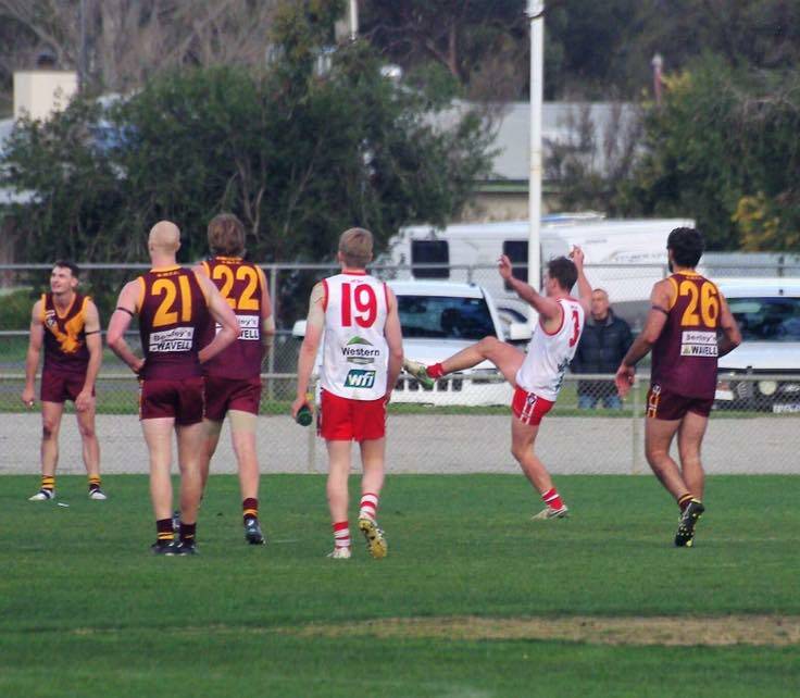 Nick Mendes watches his kick sail through for the goal that levelled the scores between the Ararat Rats and Warrack Eagles at Anzac Park after the siren. Picture: CONTRIBUTED