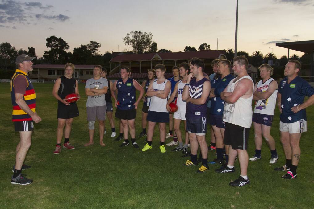 LEADER: Brian Jenkins talks to his charges at pre-season training. Picture: PETER PICKERING