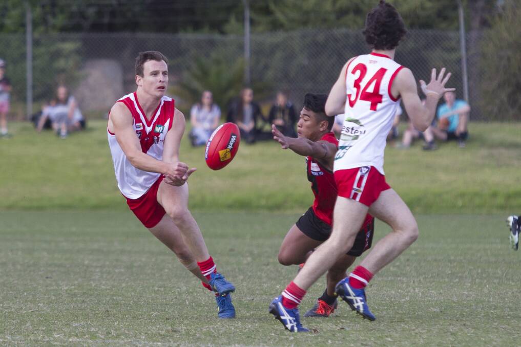 HANDS: Ararat's Ben Free gets the ball moving by hand in the side's round one match. Picture: PETER PICKERING