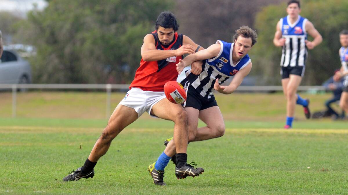 Tom Taurau bumps Adam Schache out of the way when Stawell and Minyip-Murtoa clashed in round 12. Picture: PAUL CARRACHER