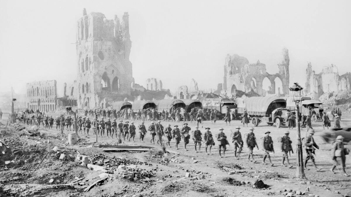DESTRUCTION: Australian troops passing the ruins of Ypres on the way to the front line October 25, 1917. PHOTO: AWM E04612 