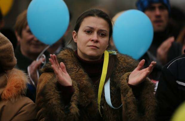 Yula Yavorska listens to speeches at Shevchenko Park during a pro-Ukrainian rally, in Simferopol, Crimea. Photo: Kate Geraghty