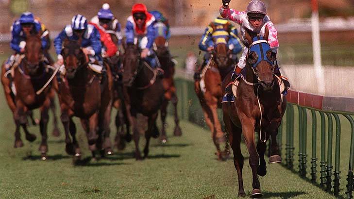 Might and Power winning the 1997 Caulfield Cup. Photo: Jack Atley