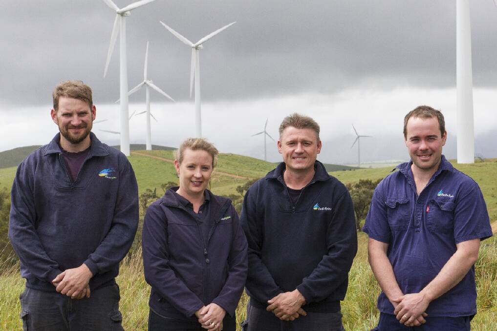 Pacific Hydro staff employed at the Challicum Hills Wind Farm, Leigh Roberts, Sally Buckingham, Dean Tonkin and Rohan Calvert, have to work in all weather, including the wet and blustery conditions of last week. Pictures: PETER PICKERING