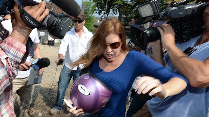 Sister Mercedes Corby battles the media throng outside the prison on Friday. Photo: Justin McManus