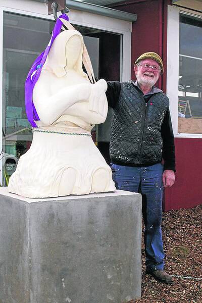 Artist Kevin Free with the newly installed statue at St Mary s Primary School. Pictures: PETER PICKERING