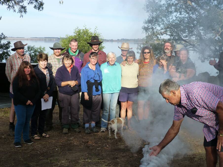 The walking group on the East Beach of Lake Bolac with elder Ted Lovett (front) who conducted the smoking ceremony at the start of the first day s walk.
