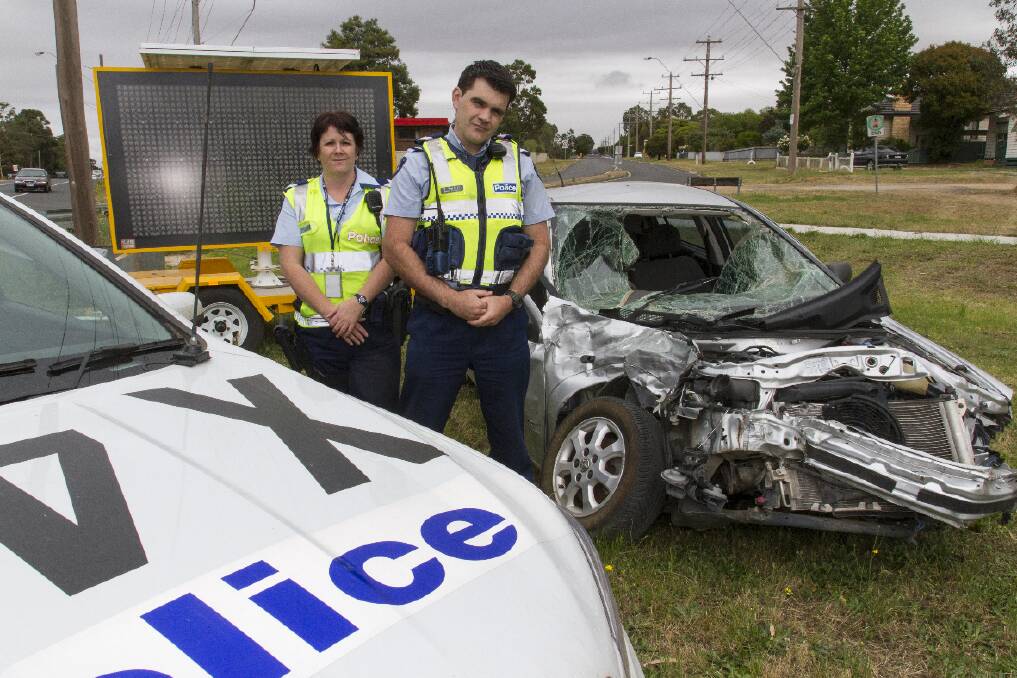 Ararat police officers Toni Chegwin and Ross Murdoch at the road awareness display in Lambert Street. Picture: PETER PICKERING