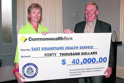 East Grampians Health Service board president Sally Philip accepts a cheque from Victoria Police Blue Ribbon Foundation Ararat branch president Terry Weeks. Picture: PETER PICKERING