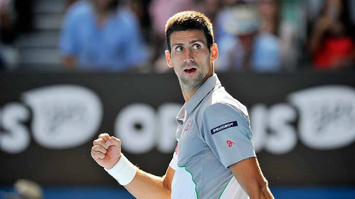 Looking back in happiness: Novak Djokovic has the beginnings of a smile on his face after a comprehensive fourth-round win over Fabio Fognini on Sunday. Photo: Joe Armao