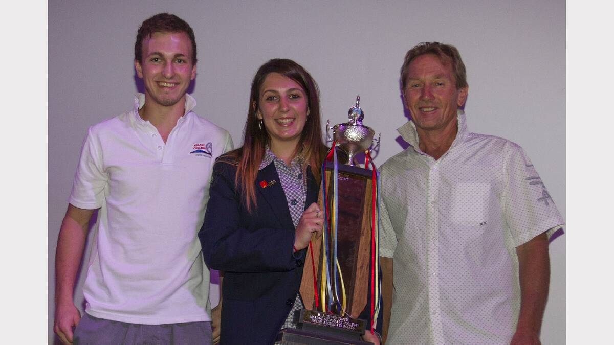 Jake Robinson and Madi Dalgleish accept the Wally Grubb teams sports' award for red house from Chris Barwick.