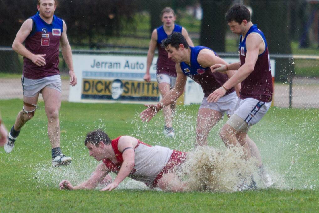 Aaron Searle makes a splash during one of the Ararat Rats damp encounters in the Wimmera Football League.
