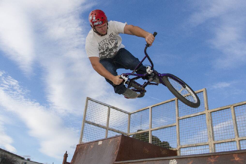 Mark Rudolph in the midst of a bicycle jump.