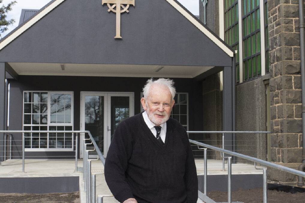 Father Brendan Davey outside the new St Mary's Parish Centre. 