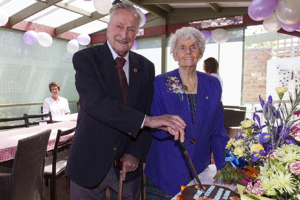 Harold and Sylvia Bright cut the cake at the celebration for their 70th wedding anniversary in December. Pictures: PETER PICKERING