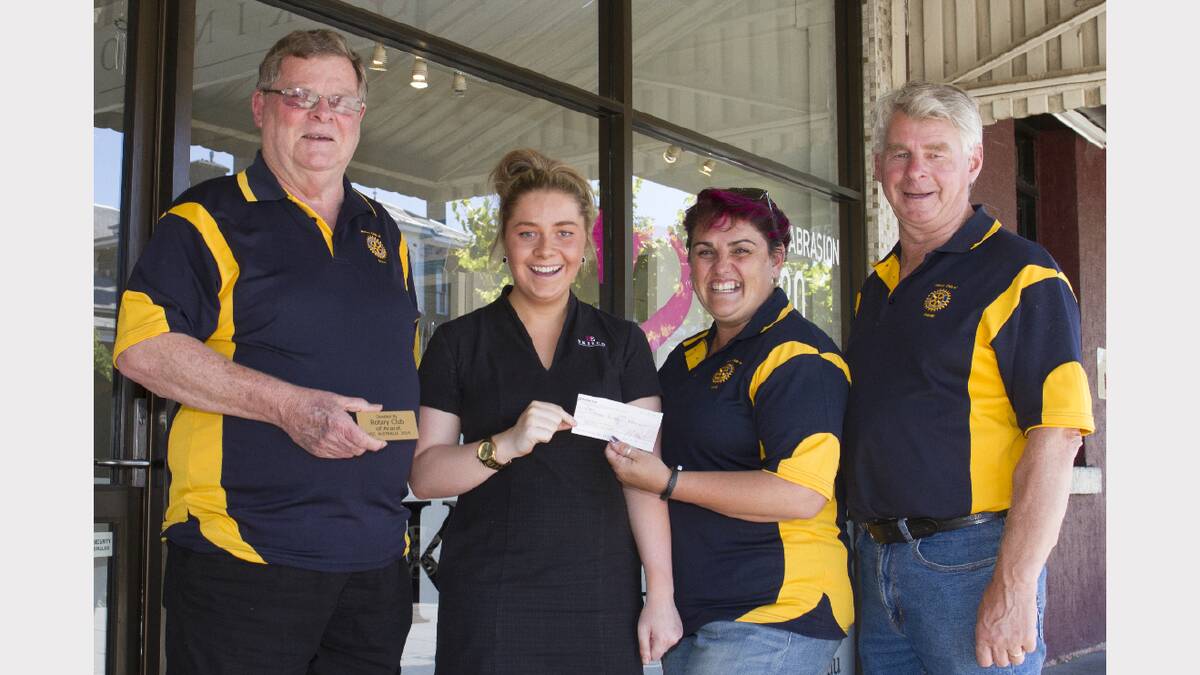Ellie Price receives a donation from Rotarians Ron McCormick, Ange Stacpoole and Morrie Allgood. Pictures: PETER PICKERING