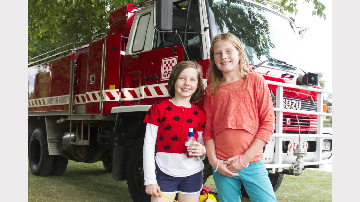 Gretta and Abbie have a look at the firetruck at the 2013 Carols by Candlelight.