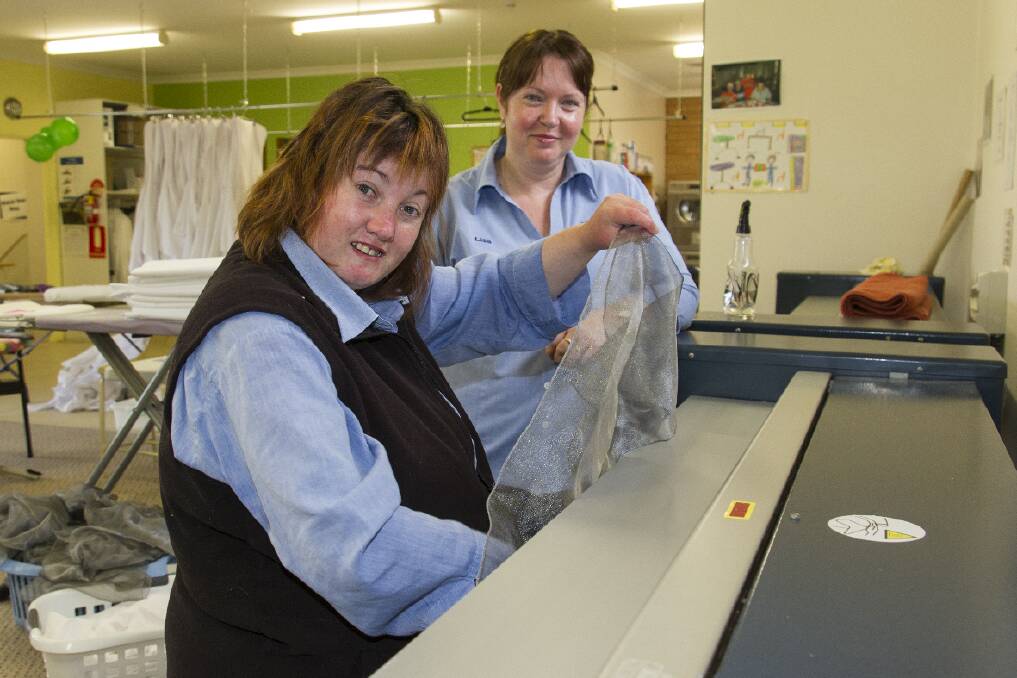 Supervisor Lisa Eastick (right) with Brooke at the Ararat Laundry, during the Pinnacle open day.