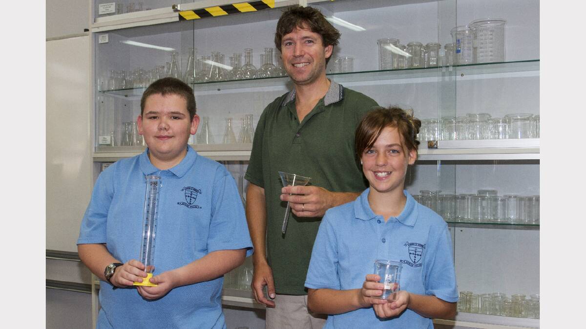 Nathan Baker gives Luca and Kiana their first science lesson at Marian College.