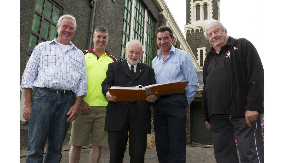 Going over plans for the St Mary’s church extension were chairman of the Parish Centre committee Peter Brady, builder Andrew Eastick, Father Brendan Davey, project consultant Max Perovich and committee member Tom Rees. Picture: PETER PICKERING