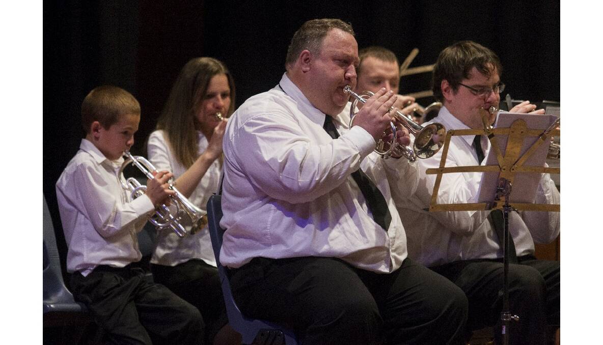Ararat City Band president Scott Barrie and some of the young performers in a joint concert between the band and Marian College music students. Pictures: PETER PICKERING