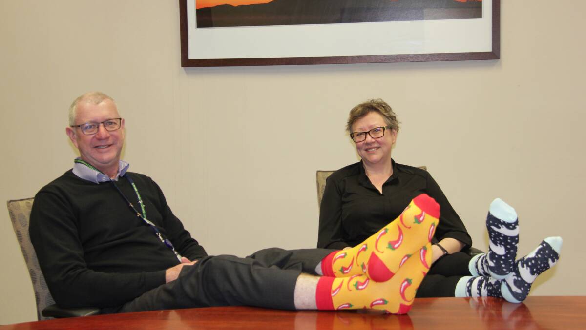 DOCS: EGHS chief executive Andrew Freeman and EGHS director of medical
services Dr Sophie Ping wearing their crazy socks. Picture: CONTRIBUTED