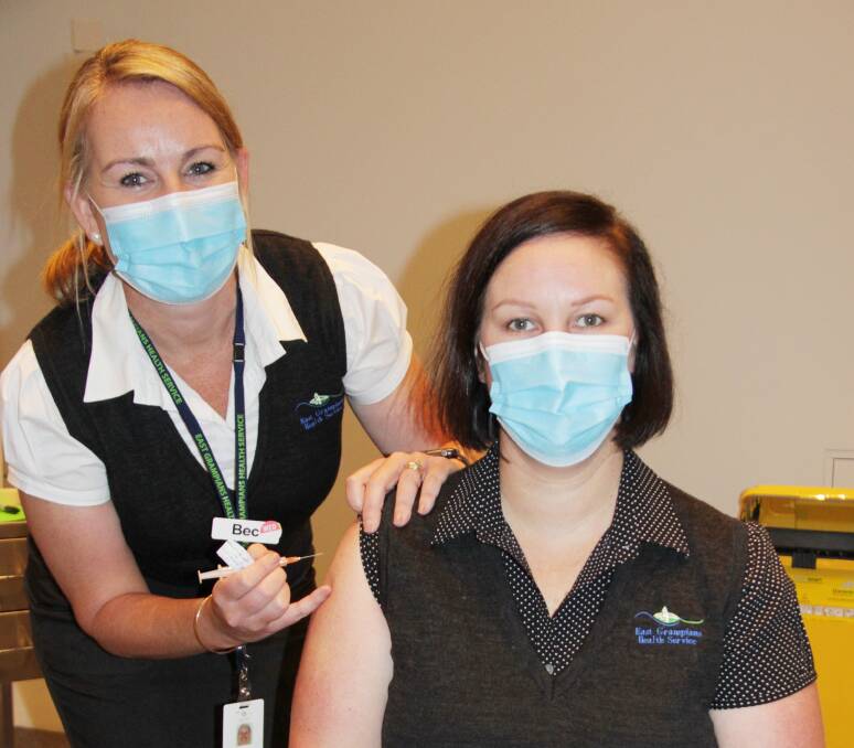 FIRST: Nurse immuniser Bec Peters prepares to give Claire Sladdin her vaccine. Picture: SUPPLIED