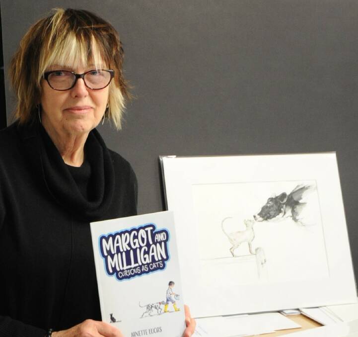 STORY TIME: Ararat author and illustrator Janette Lucas with her new children's book Margot and Milligan: Curious as Cats. Picture: KLAUS NANNESTAD