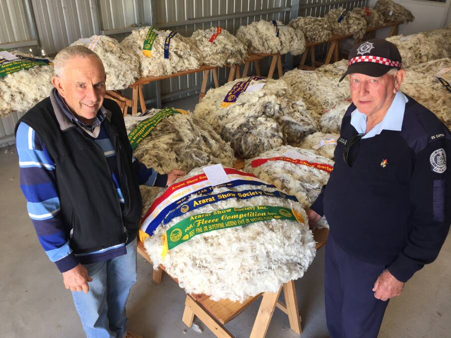 ON SHOW: Ray Robinson and Rob Keith with the champion fleece at the 2019 Ararat Show. Picture: FILE