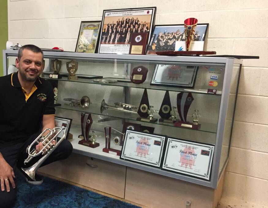 ARARAT CITY BAND: Bruno Andrade with some of the trophies Ararat City band has collected throughout the years. Picture: KLAUS NANNESTAD