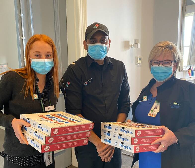 HELPING HAND: Domino's Ararat franchisee Nick Makawana delivering pizzas to EGHS staff. Picture: CONTRIBUTED