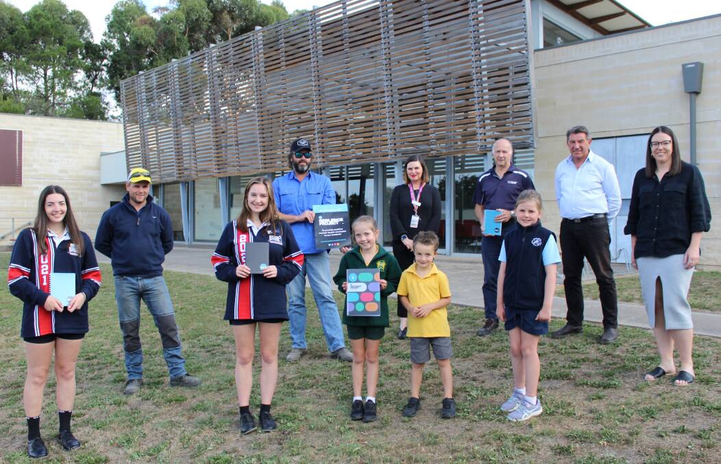 SPONSOR SUPPORT: PHOTO: L-R Ebony, Mia, Milla, Archie, and Lucy with Mellow in the Yellow committee members Anthony Brady and Mick Morgan, Grampians Pyrenees Primary Care Partnership executive officer Suzannah Burton, Ararat Community Enterprise members Russell Pearce and Max Perovich, and Central Grampians LLEN acting chief executive Jane Moriarty. Picture: CONTRIBUTED