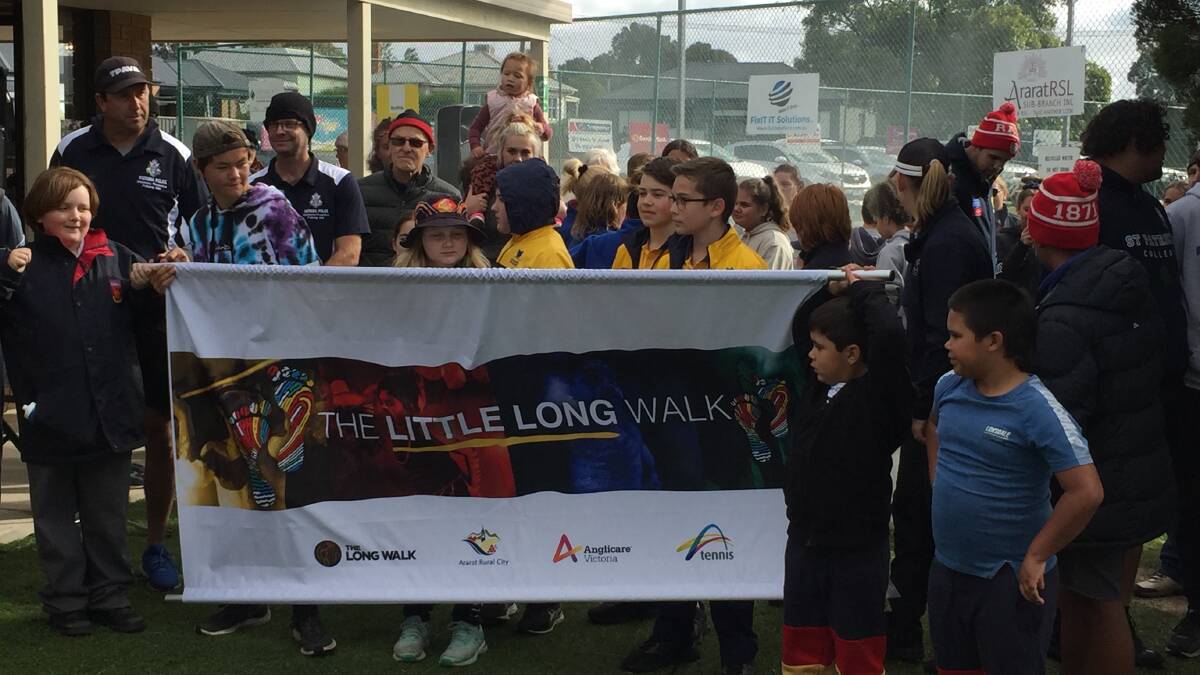 THE LONG WALK: Students hold up The Little Long Walk banner. Picture: KLAUS NANNESTAD
