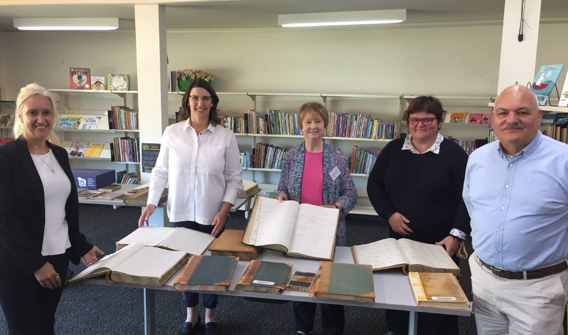 A SLICE OF HISTORY: Department of Health and Human Services records officer Mary Reader, Ararat Rural City Council mayor Jo Armstrong, Ararat Genealogy Society secretary and research lead Marion McAdie, DHHS senior digital archivist Michaela Hart, and Public Record Office Victoria assistant director access services David Taylor. Picture: KLAUS NANNESTAD
