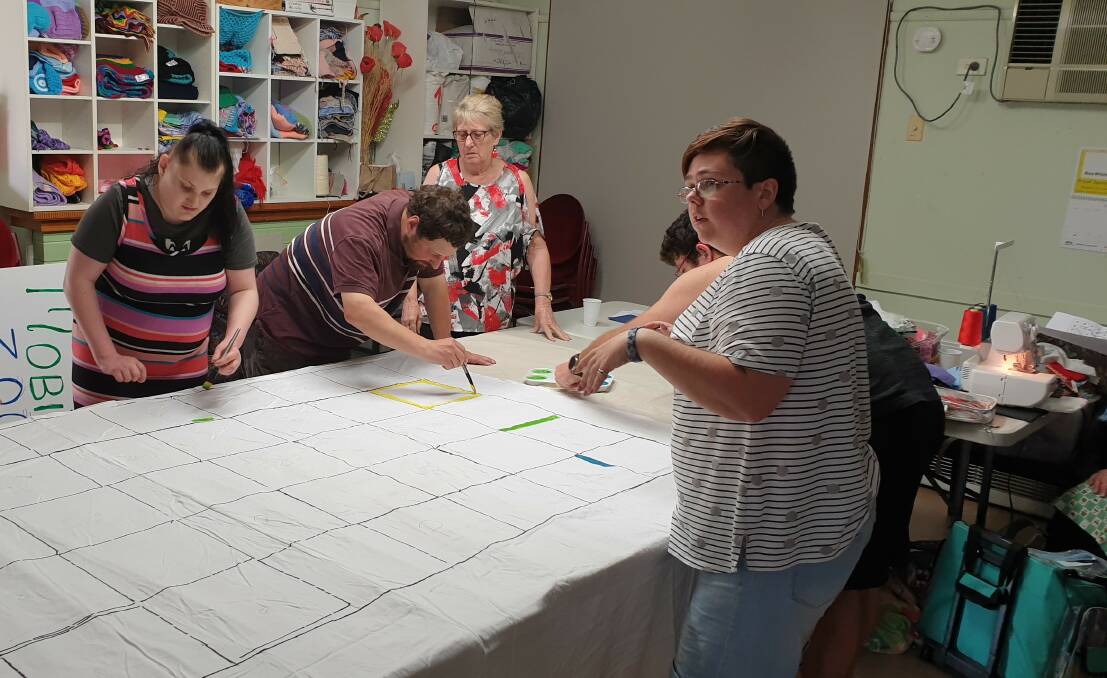 TEAMWORK: The Ararat Peer Support program group began creating a life-sized game of Snakes and Ladders before lockdown. Picture: CONTRIBUTED
