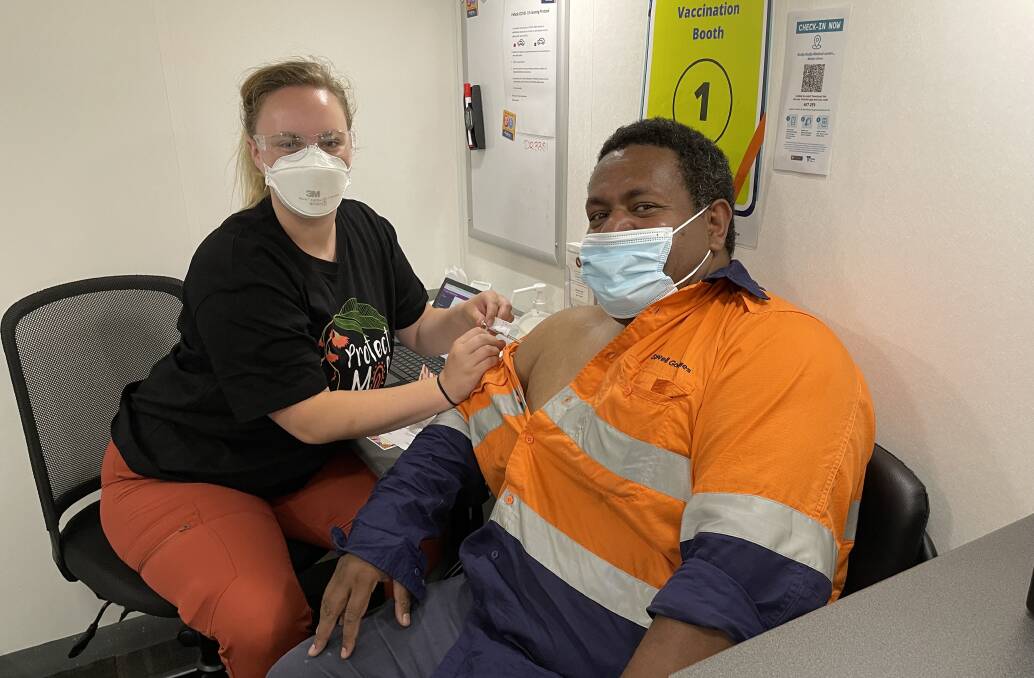 JAB: VACCHO immuniser Lydia Rawlings vaccinated Jope Nawai. Picture: ALEX DALZIEL