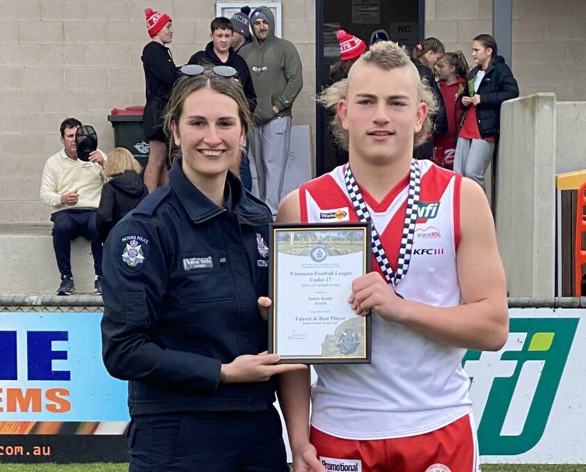 DEDICATED: Sonny Kettle receiving his award from his sister, Horsham police officer Bianca Kettle at Alexandra Oval. Picture: CONTRIBUTED
