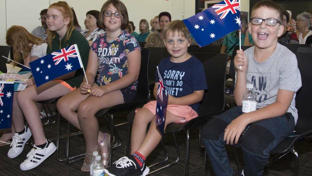  AUS DAY: Children wave flags and watch the Australia Day 2019 ceremony. Picture: PETER PICKERING
