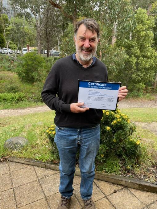 RECOGNITION: Graham Parkes accepting his certificate of lifelong appreciation.Picture: CONTRIBUTED,GCH. 