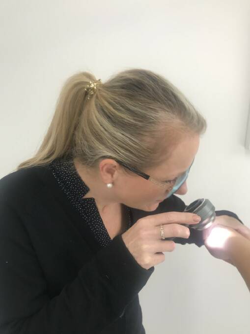 Melbourne-based clinical nurse consultant, Sharon Hudson with a dermoscope. Picture: CONTRIBUTED