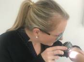 Melbourne-based clinical nurse consultant, Sharon Hudson with a dermoscope. Picture: CONTRIBUTED