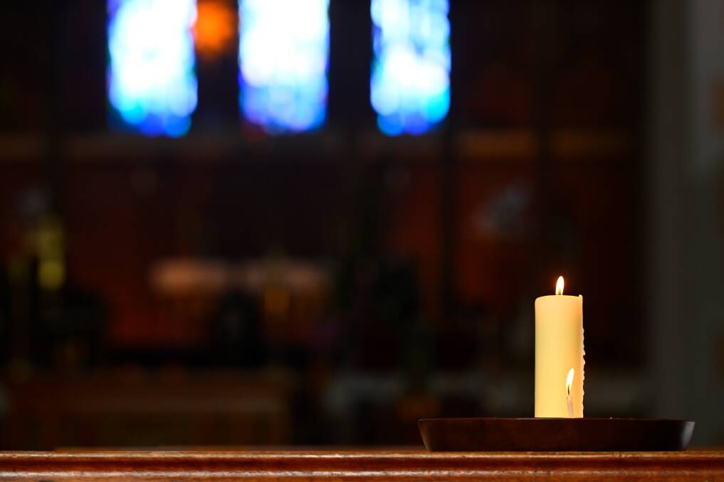 One of the candles lit for the five victims of a deadly car accident that stunned Daylesford on Sunday night. The Anglican Church in Central Springs Road will host a service for all faiths on Wednesday night. Picture by Adam Trafford. 