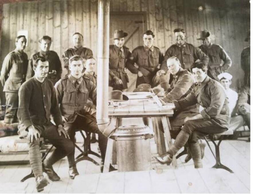FAR FROM HOME: John Langford Naylor (front left with pipe) is pictured here with other WW1 Australian soldiers, probably in a rehabilitation hospital in England. After being wounded in the Somme he never returned to Australia.