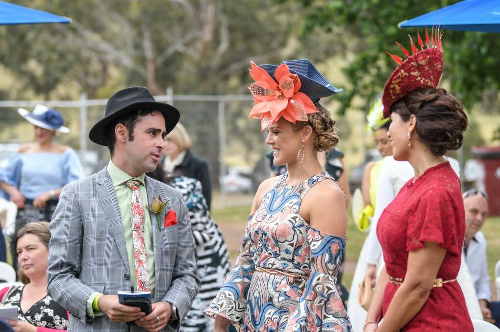 Melanie Wade, centre, chats to Ben Carbonaro and Kelly Carty at the Ballarat Cup last year. Picture: COUNTRY RACING FASHION