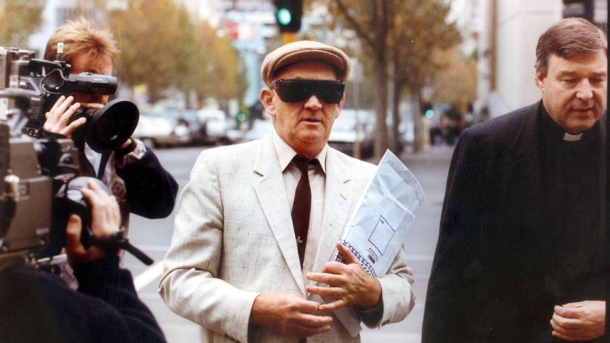  Gerald Ridsdale outside court, supported by with George Pell, in 1993.